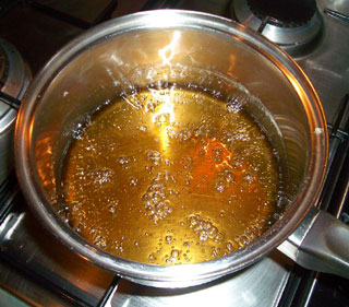 Sugaring Recipe Ingredients Being Boiled in Saucepan